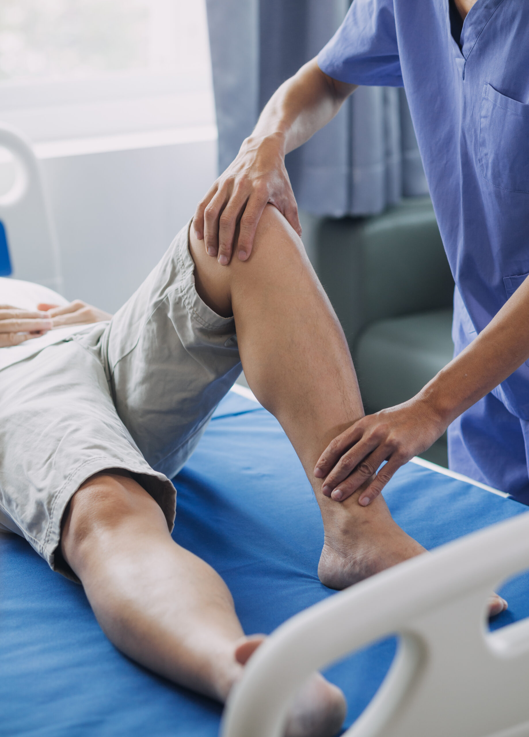 Physician examining a patient's knee